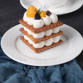 round white porcelain dessert plate perfect for cakes, pastries, and snacks